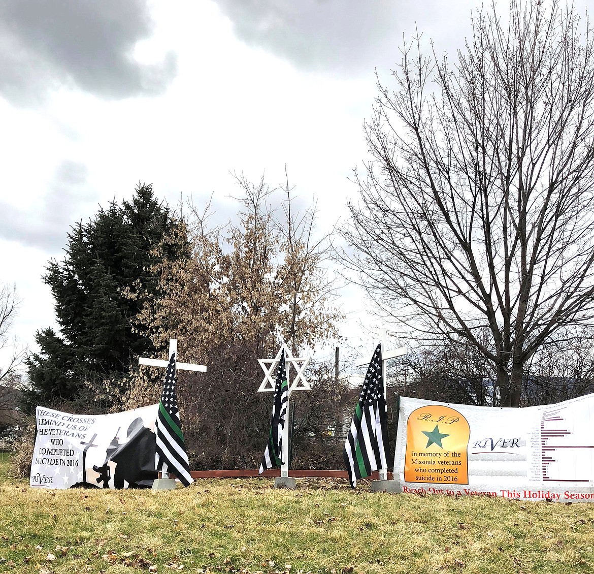 Banners and flags raising awareness of veteran suicide are erected in downtown Plains on Monday by members of the Joint Operations of Maripossa.  (Erin Jusseaume photos/ Clark Fork Valley Press)