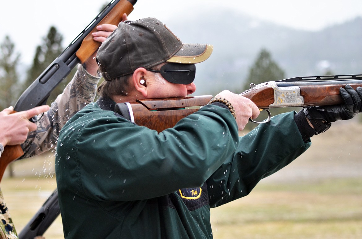 Plains shooter Tony Colombo is not worried about the snow as he takes aim in the first round of the Annie Oakley at the Plains Trap Club on Saturday. (Erin Jusseaume photos/ Clark Fork Valley Press)