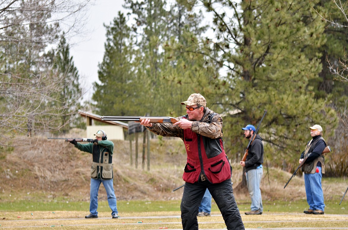 Henry Miller of Hamilton, center, takes aim in the buddy shoot.