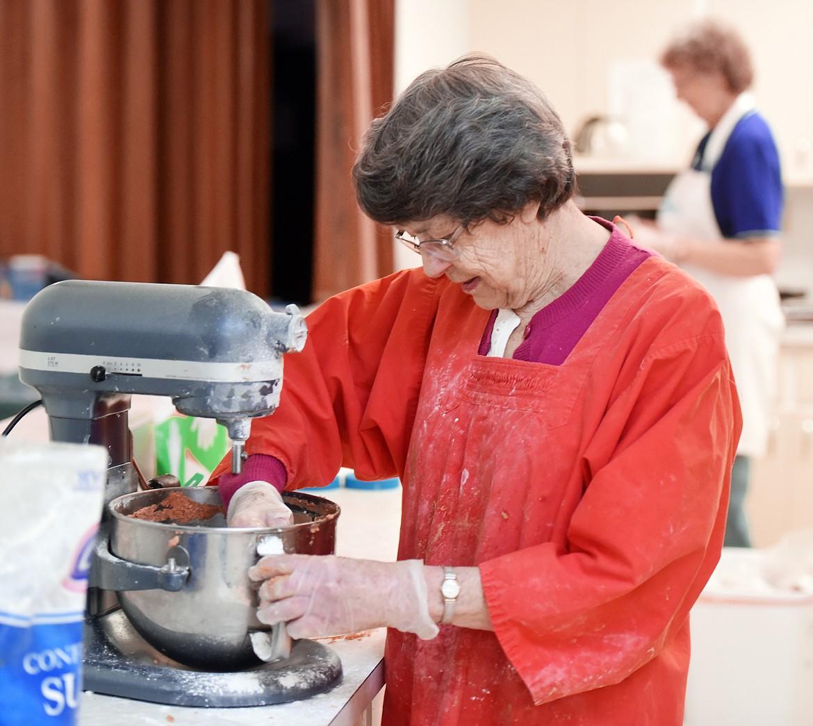 Barbara Lawrence making the secret recipe for peanut butter filling for the Central Christian Church Easter eggs on Thursday morning, March 15, in Kalispell. The volunteers spent days making coconut, butter cream, mint and finally peanut butter eggs as part of their annual fundraiser. They work with peanut butter last to protect volunteers and buyers who have nut allergies.(Brenda Ahearn/Daily Inter Lake)