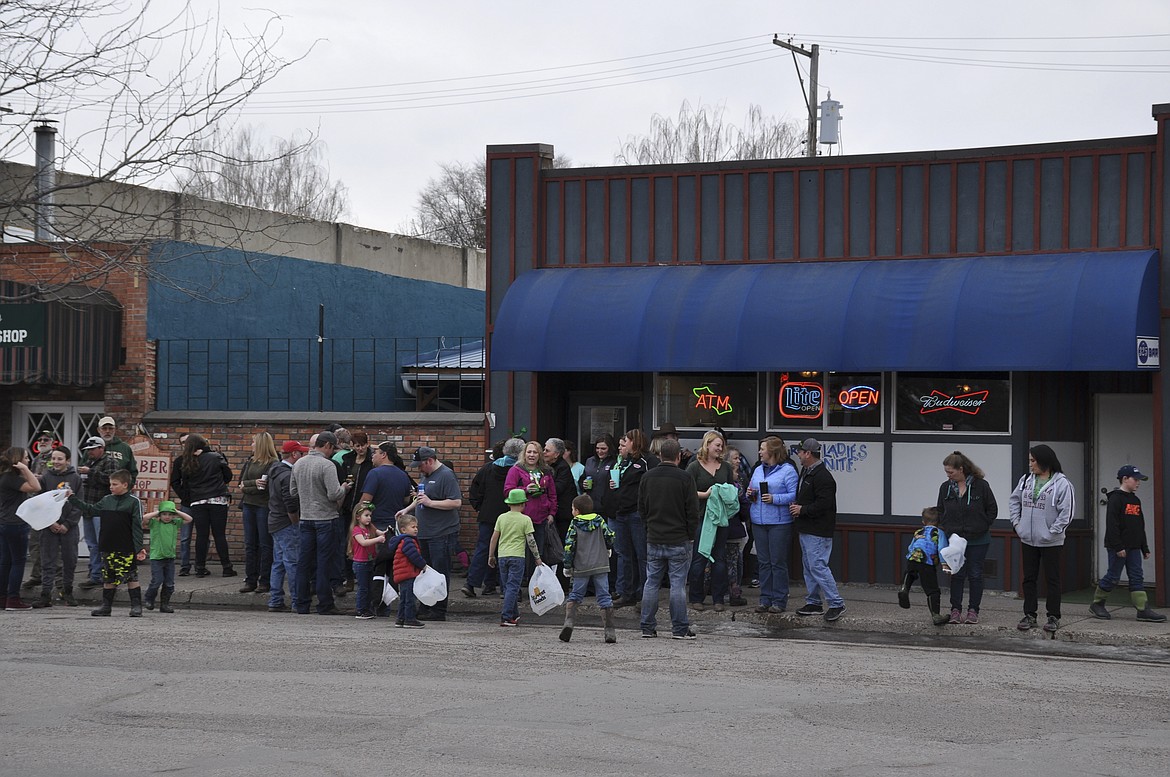 PATRONS AT THE 325 Bar in Ronan stand outside the establishment, waiting for the O&#146;Ronan St. Patrick&#146;s Day Parade on the holiday. (Ashley Fox/Lake County Leader)