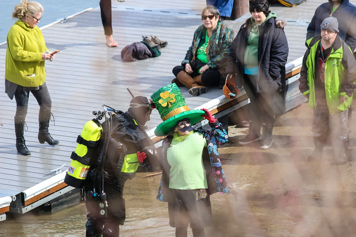 Photo by MANDI BATEMAN
Rescue diver assists the olderst plunger, 84 year old Marciavee Cossette.