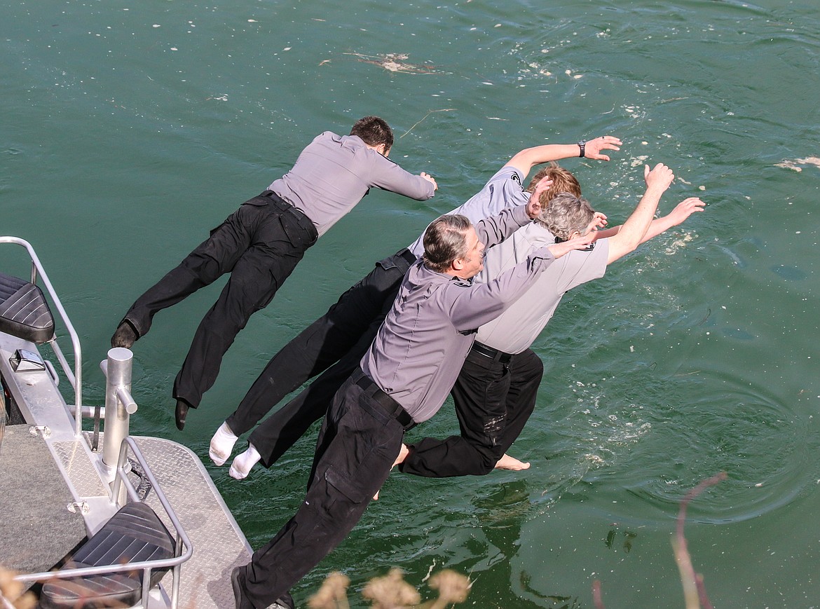 Photo by MANDI BATEMAN
The last jumpers were Sheriffs Reserve Deputies Steve Ussher, Anthony Compton, Brandon Johnson, and Detention Deputy Brandon Blackmore, and Reserve Cpl. Jim Paulus, who all jumped off the Sheriff&#146;s boat.