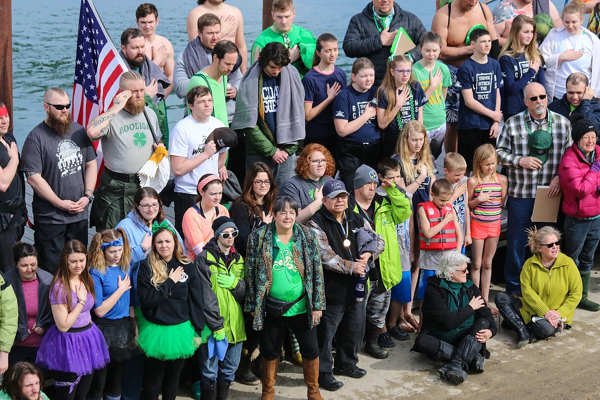 Photo by MANDI BATEMAN
The jumpers and Special Olympics athletes gathered on the dock before the jump, listening to the national anthem.