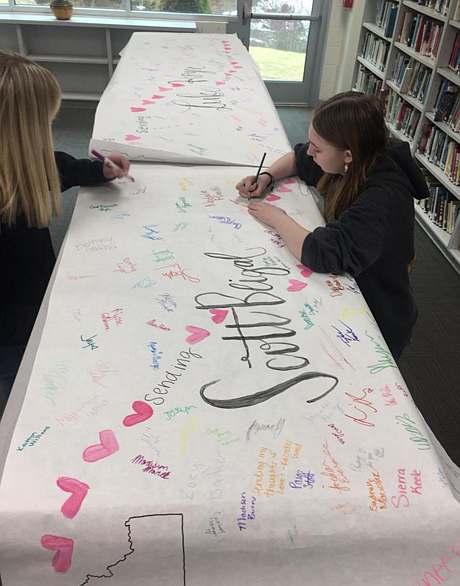 Courtesy photo
Students in the Kellogg High School library signing a memorial poster.