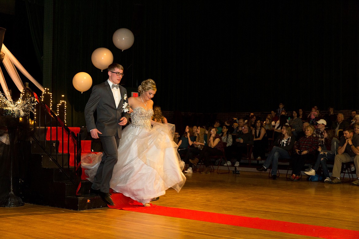 Dawson Young, left, and Alyssa Marshall participate in the Grand March at Libby Prom on Saturday, March 17, 2018. (John Blodgett/The Western News)