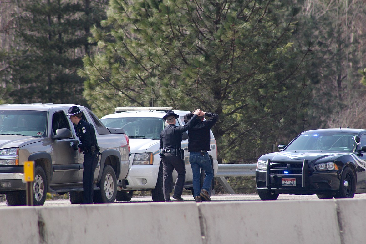 A male suspect is taken into custody following a traffic stop on eastbound I-90 next to Pinehurst. Witnesses reported seeing officials pulling out large amounts of marijuana from the vehicle the suspect was operating.
