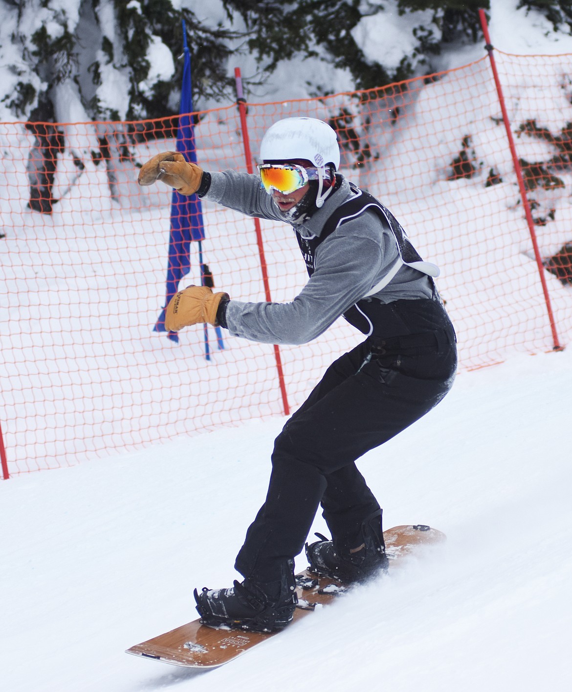 A frosty snowboarder rounds a turn at the Nate Chute Banked Slalom and Boardercross competition last weekend at Whitefish Mountain Resort.