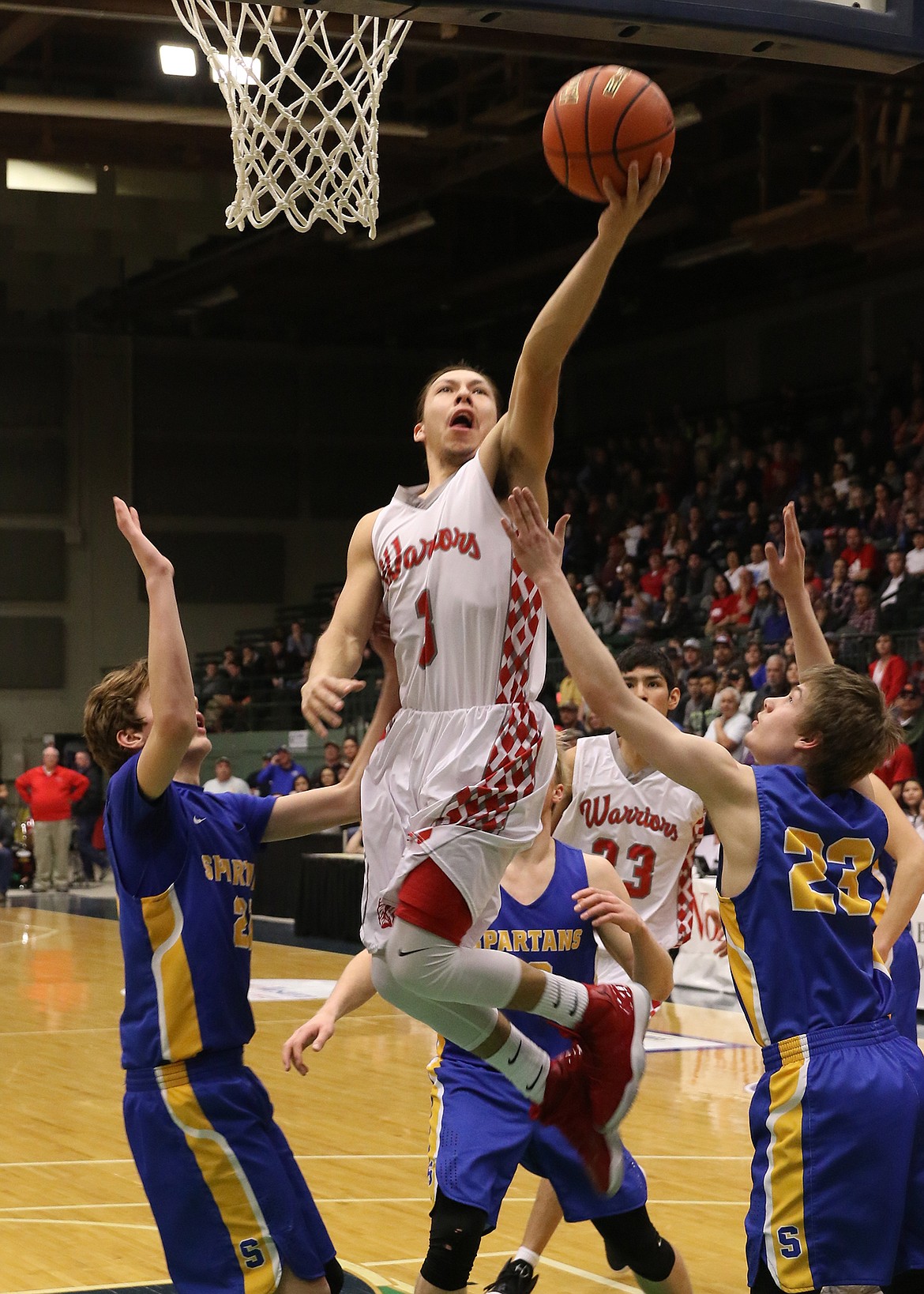 ARLEE GUARD Will Mesteth drives to the basket during the MHSA Class C State Championship Basketball game against Manhattan Christian at the Butte Civic Center. Mesteth was one of several Mission Valley area players that will represent Arlee during the Mission Mountain All-Star basketball game at 8 p.m. Thursday night at the Ronan Events Center. (photo courtesy of Bob Gunderson)