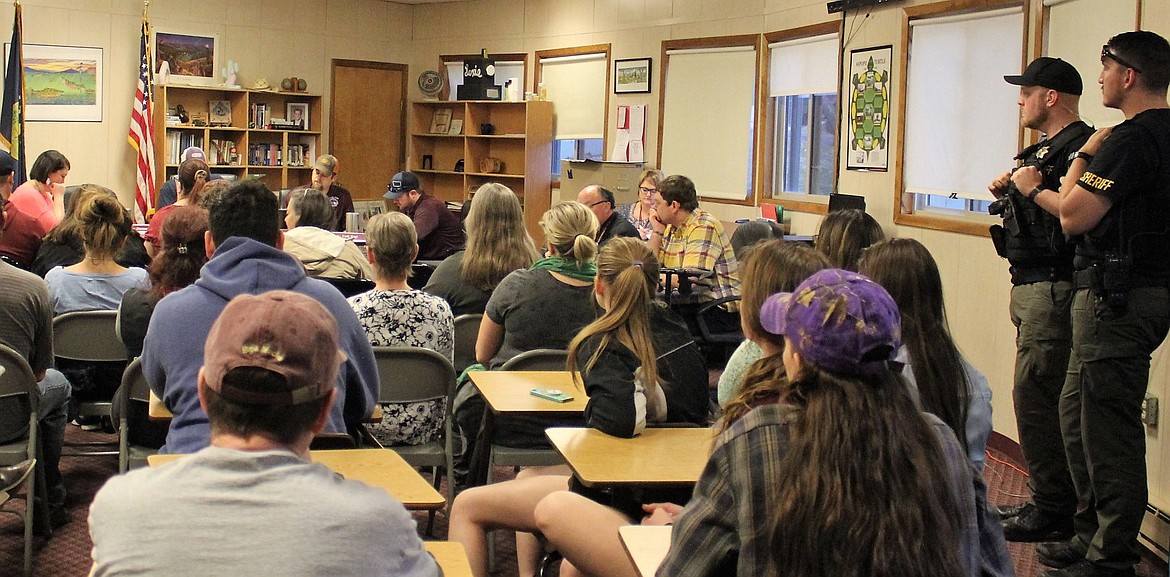 On March 13 community members packed the Alberton School Board meeting to discuss the school principal, Kyle Fisher (pictured in a yellow plaid shirt), and his administrative leave, which lasted three weeks. (Kathleen Woodford/Mineral Independent)