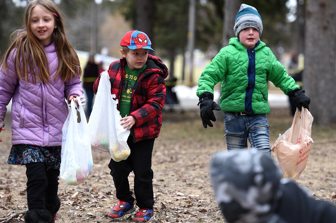 Children search for eggs during the 6th annual Flathead Shelter Friends Easter Egg Hunt at Woodland Park on Saturday in Kalispell. (Casey Kreider/Daily Inter Lake)