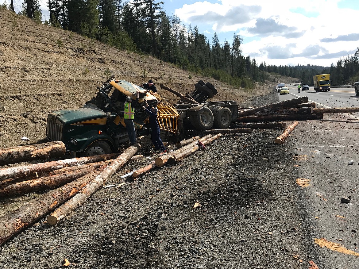 JIM MOWREADER/Press
The Idaho State Police investigated a one-vehicle log truck crash Thursday. David T. Stanton, 45, of Orofino, was traveling northbound on U.S. 95 at milepost 420, just south of Coeur d&#146;Alene. Stanton drove off the right shoulder of the roadway, striking a guardrail end. The log truck continued up the embankment and overturned. The northbound lanes were blocked for 20 minutes until traffic control was set up. Stanton was transported to Kootenai Health, it is unknown if he was wearing a seat belt at the time of the crash.