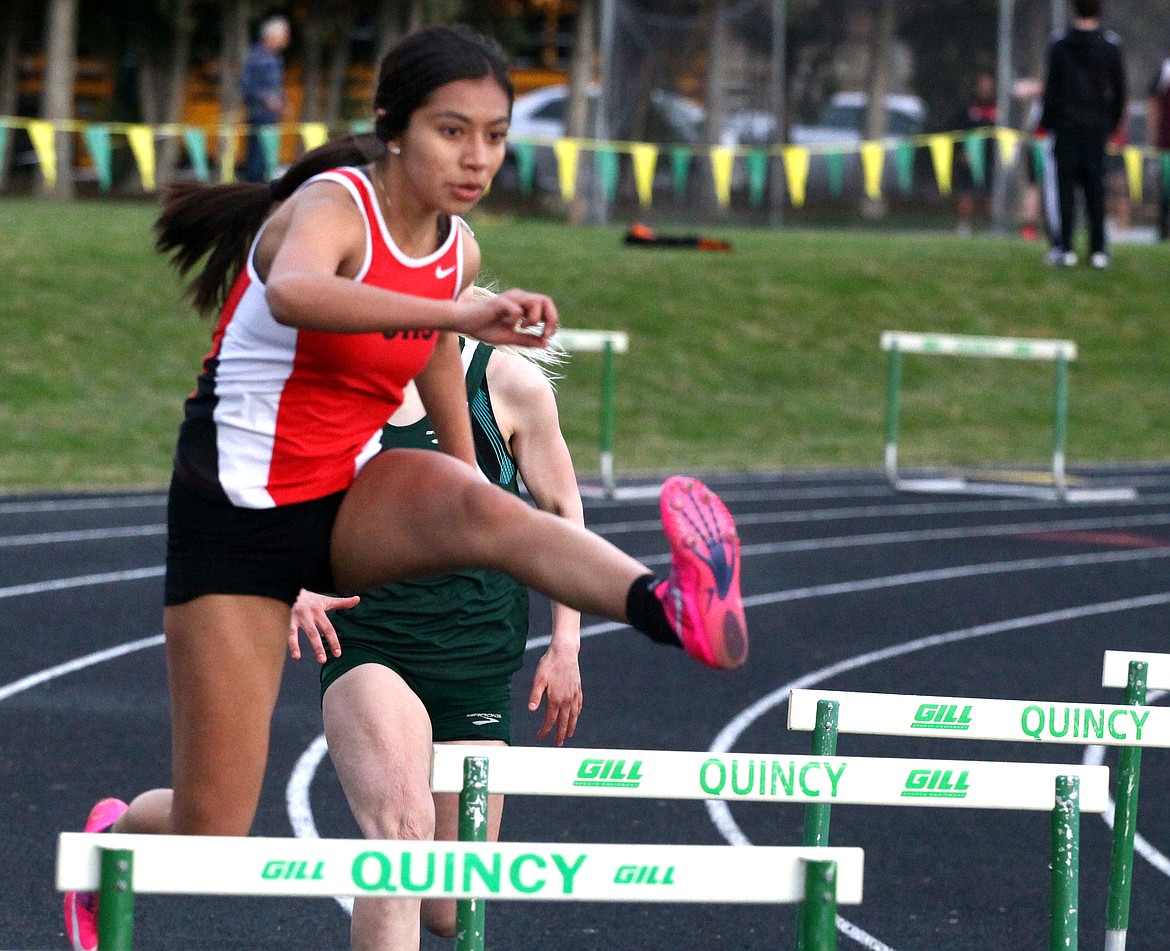 Rodney Harwood/Columbia Basin HeraldOthello freshman Galilea Gonzalez pushes around the corner in the girls 300-meter hurdles Thursday at the Best of the Basin track and field meet in Quincy.