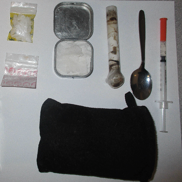 Photo courtesy of SCSO/ A drug user&#146;s kit complete with a storage container, a pipe, hand holder and a spoon. The substance to the left is meth (crystal and powder) and to the right is a meth loaded needle.