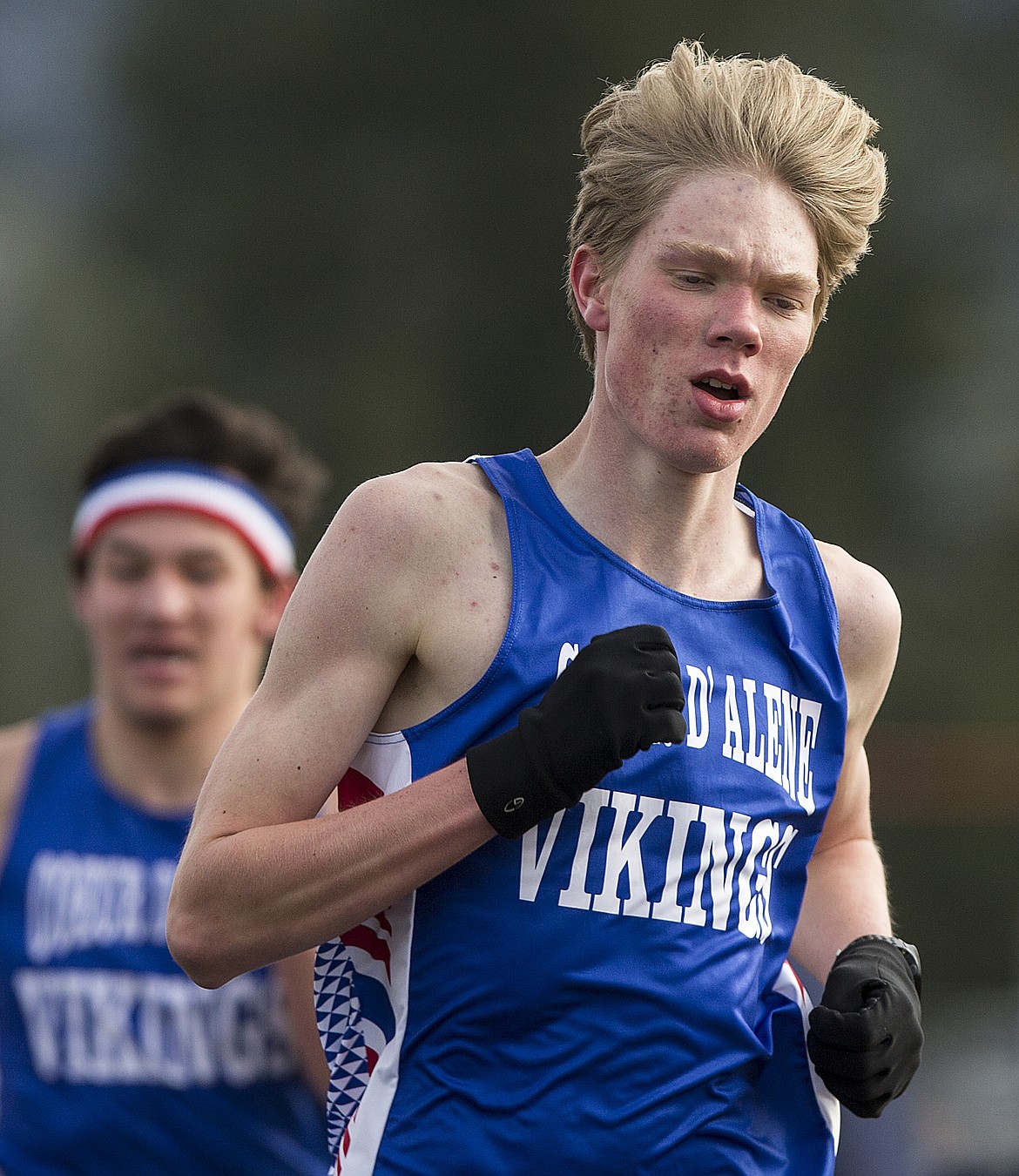 Coeur d&#146;Alene High&#146;s Chad Humphries crosses the finish line first in the boys 1,600-meter run at the Kootenai County Challenge on Friday in Spirit Lake.