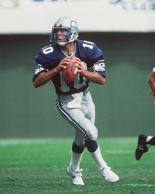 Seattle Seahawks receiver Steve Largent (80) catches a Jim Zorn pass and  moves into the end zone with Washington's Darrell Green (28), holding on in  the second quarter of their NFL game