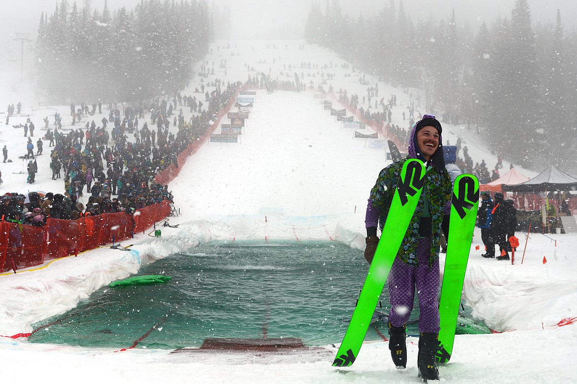 Danner Pickering celebrates after being named the pond skim ski winner at the 2018 Whitefish Pond Skim at Whitefish Mountain Resort on Saturday. (Casey Kreider/Daily Inter Lake)