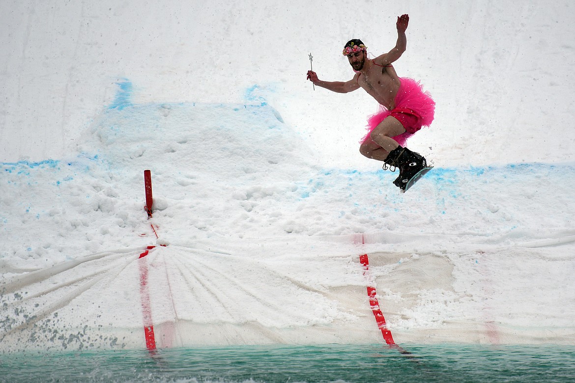 Tim Butler crashes into the pond during the 2018 Whitefish Pond Skim at Whitefish Mountain Resort on Saturday.
 (Casey Kreider/Daily Inter Lake)