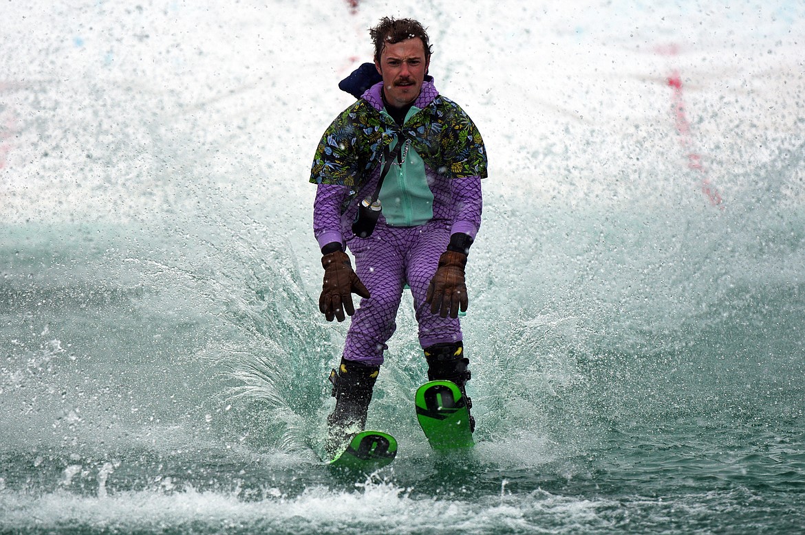 Danner Pickering navigates a successful run across the pond during the 2018 Whitefish Pond Skim at Whitefish Mountain Resort on Saturday. (Casey Kreider/Daily Inter Lake)