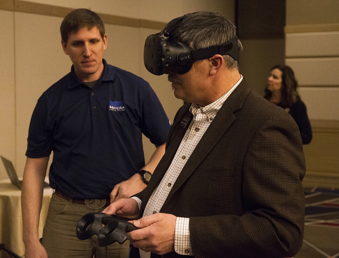 Kootenai County Commissioner Marc Eberlein plays a virtual reality demo for a new Hecla Mining machine that will be used at the Lucky Friday Mine. The Hecla machine was one of the cutting-edge technologies highlighted at the annual Jobs Plus meeting at The Coeur d&#146;Alene Resort on Wednesday.