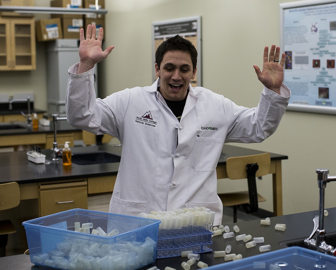 North Idaho College lab technician Mikel Buffalo reacts to winning the second annual Cap-off on Tuesday at NIC's Meyer Health and Sciences Building. Buffalo capped 72 test tubes in 55 seconds. (LOREN BENOIT/Press)