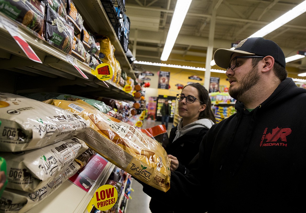 Chelsea Bowman and Jacob Ham shop for dog food at the new Super 1 Foods store at The Crossings at the intersection of U.S. 95 and Highway 54 in Athol.