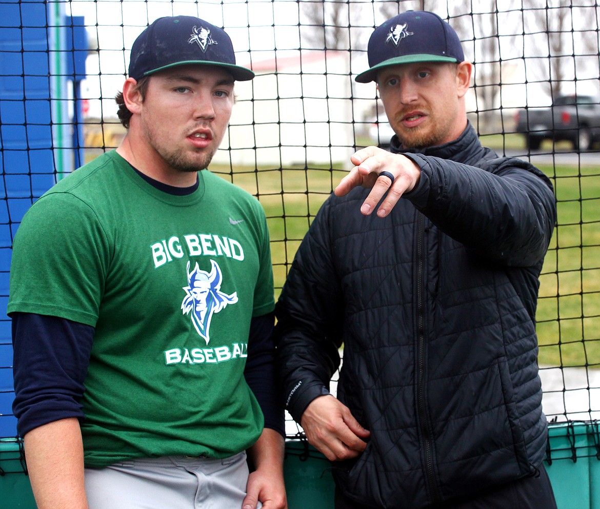 Rodney Harwood/Columbia Basin Herald
Big Bend manager Jameson Lange, right, goes over pitching strategies during practice. Jameson is in his first season as the manager and currently has the Vikings in third place in the NWAC East Region.