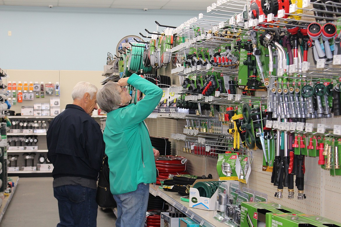 Cheryl Schweizer/Columbia Basin Herald
Customers search the very top row of the lawn and garden aisle at the new Ag Supply-Ace Hardware, which opened Thursday in Moses Lake.