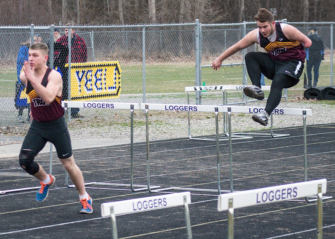 Troy juniors Hunter Jordan and Michael Beers clear hurdles in the 110m at the Eureka Invitational hosted at Libby High School, April 7. (Ben Kibbey/The Western News)