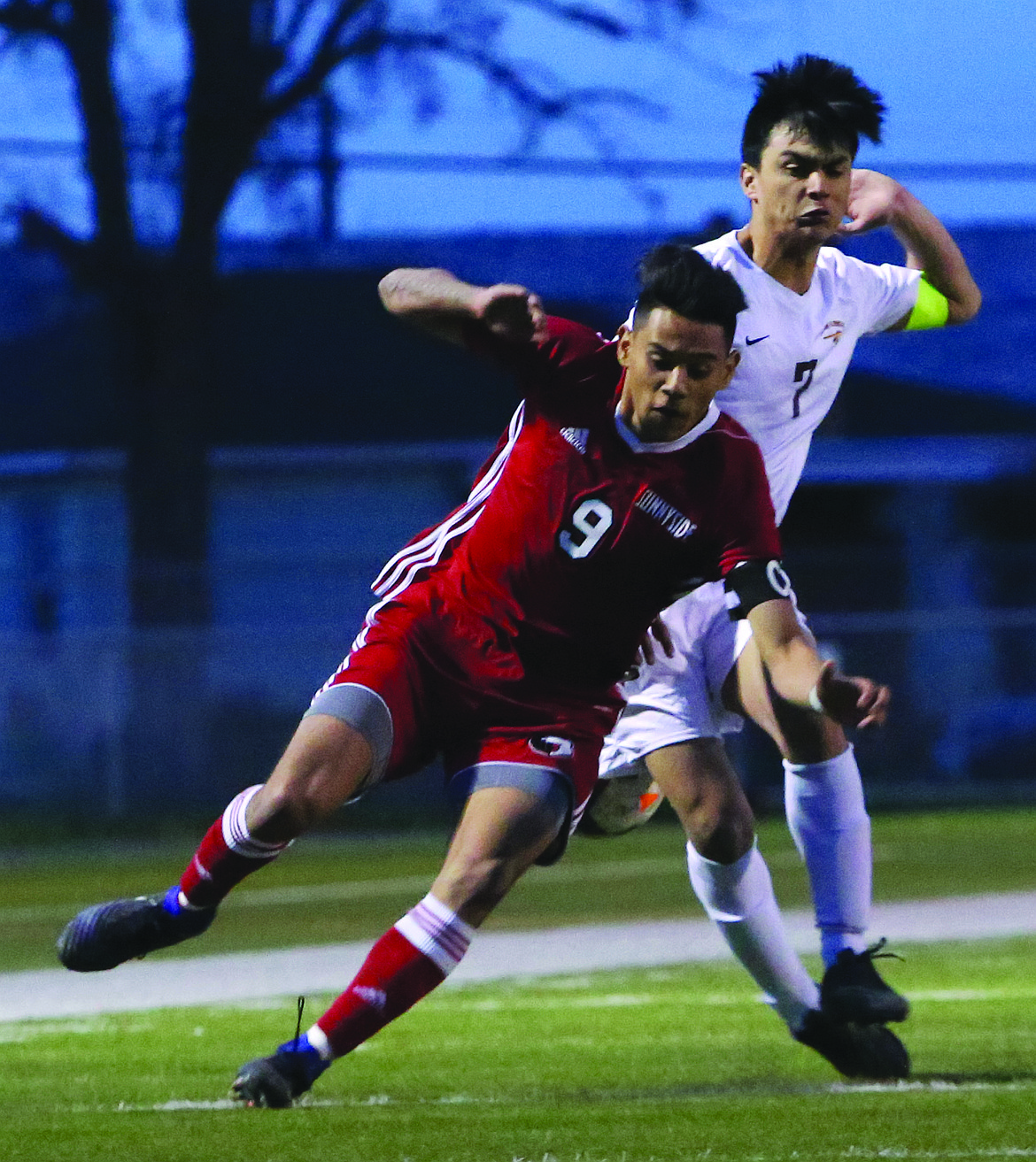 Connor Vanderweyst/Columbia Basin Herald
Moses Lake forward Anthony Cortez (right) collides with Sunnyside's Gonzalo Frausto.