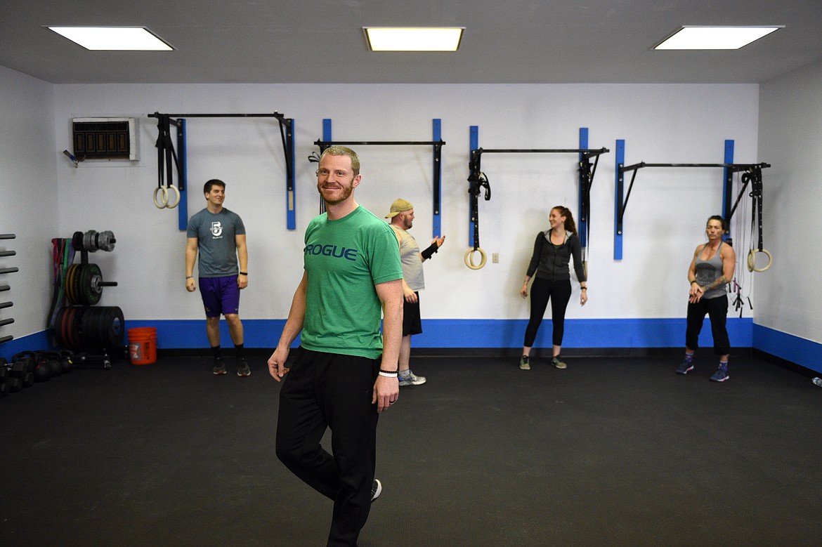 Bigfork Crossfit owner Isaac Lee leads a workout with members, from left, Brant Beaudry, Cole Armstrong, Nikkie Armstrong and Shelli Novacek on \March 28. (Casey Kreider/Daily Inter Lake)