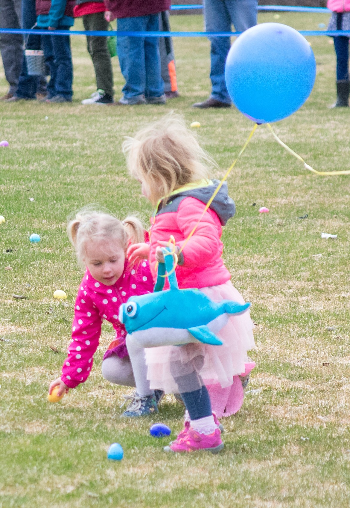 Though Ava Tallmadge and Eva Holzer had never met before, the pair spent the entire Easter egg hunt in the 1-2 year old section adding eggs to each other&#146;s baskets at the Roosevelt Park in Troy. (Ben Kibbey/The Western News)