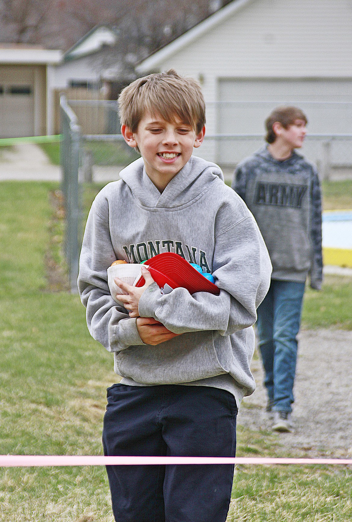 Jacob Lulack&#146;s cap overflows with Easter eggs from a successful hunt in Plains. (Jessica Peterson)