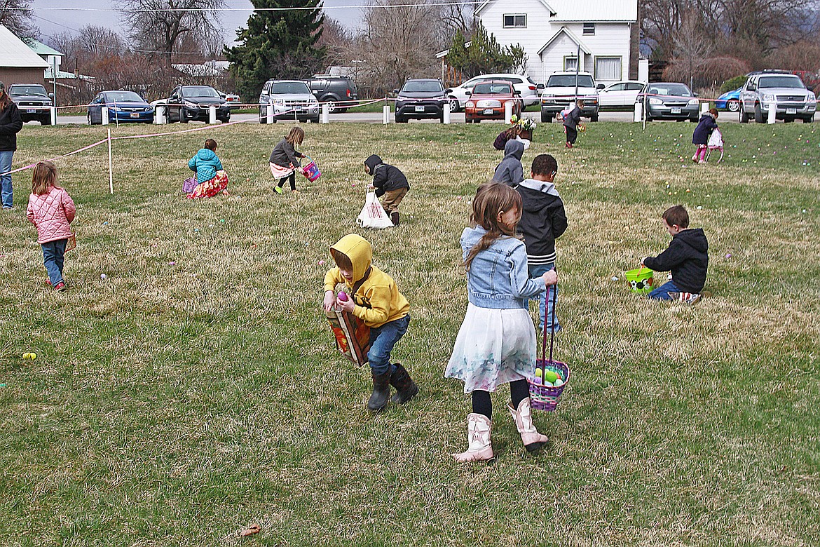 Children gather up Easter eggs at Plains Pool Park. (Jessica Peterson)