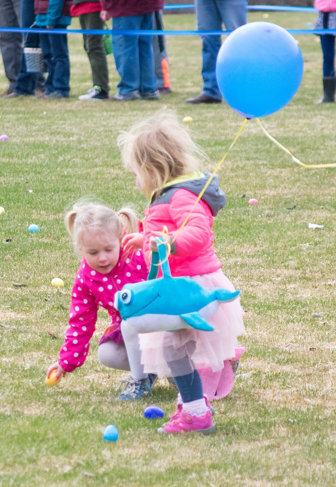 Though Ava Tallmadge and Eva Holzer had never met before, the pair spent the entire Easter egg hunt in the 1-2 year old section adding eggs to each other’s baskets at the Roosevelt Park in Troy. (Ben Kibbey/The Western News)