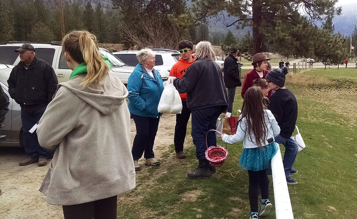 Onlookers wait in anticipation to see who would come back with the largest number of hidden Easter Eggs at the old Paradise School. (photo supplied)