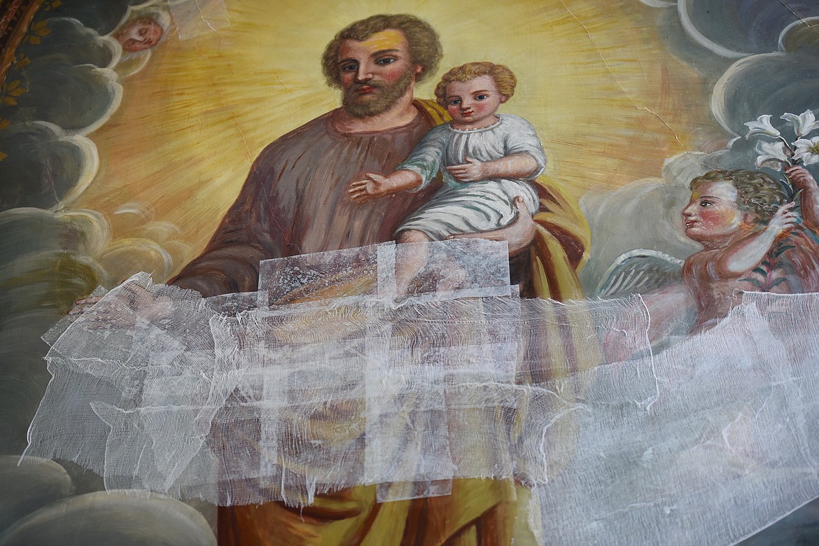 A delicate mural in the Mission Catholic Church is currently being held together as restoration funds are being raised.(Brenda Ahearn/Daily Inter Lake)