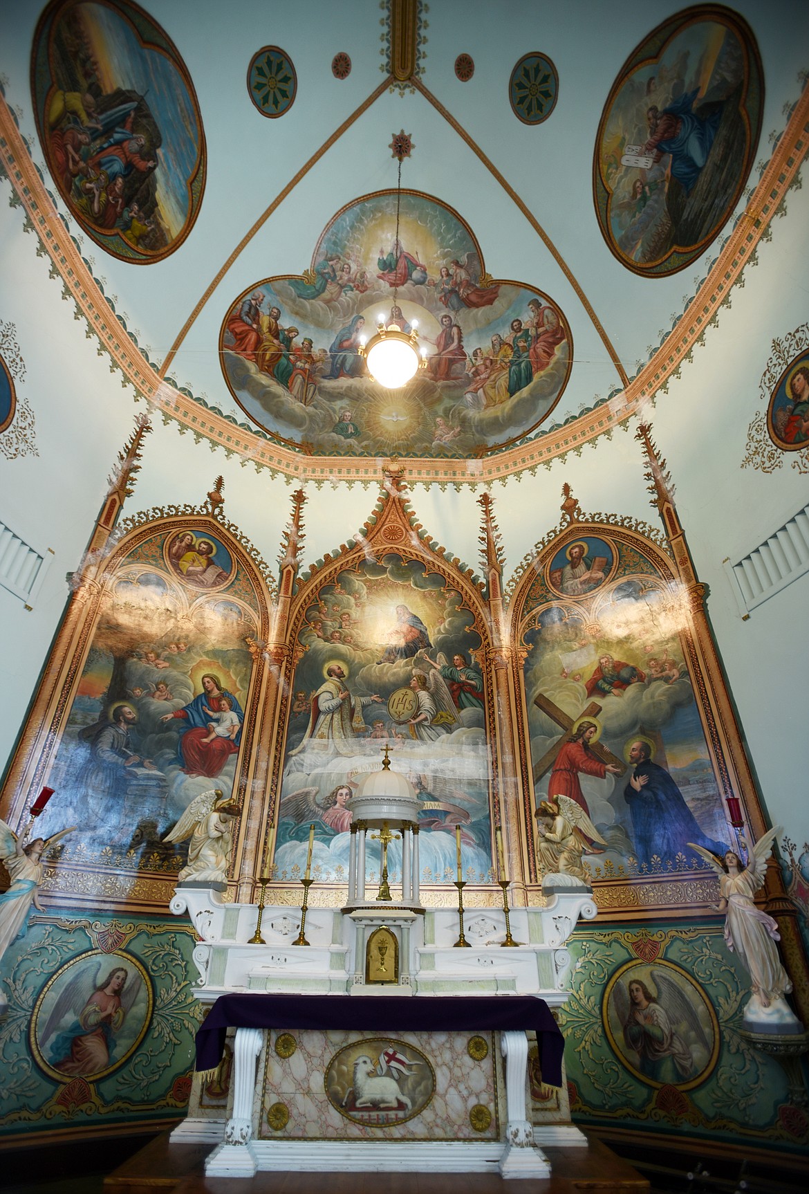 The interior of the historic Mission Catholic Church in St. Ignatius is filled with murals in need of preservation.