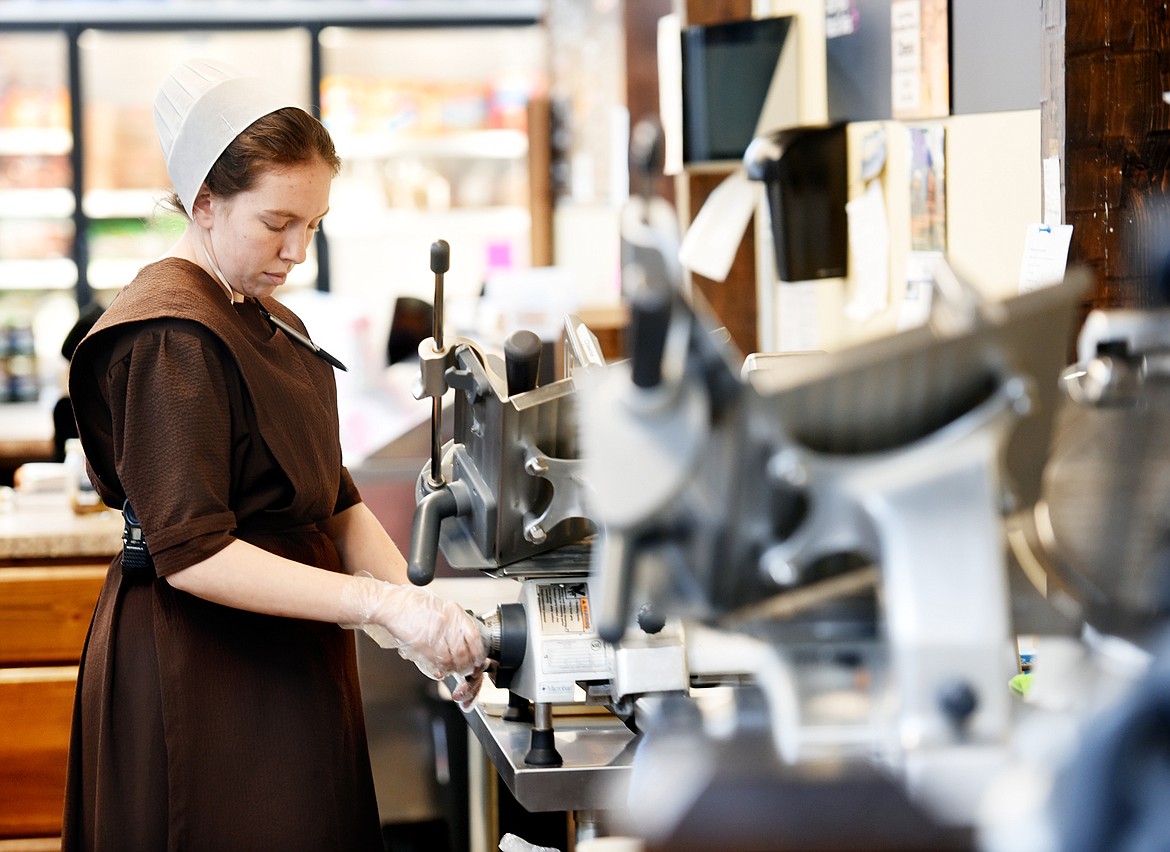 Mary Rose Bontrager makes sandwiches in the deli at the Mission General Store on Tuesday, March 15, in St. Ignatius.(Brenda Ahearn/Daily Inter Lake)