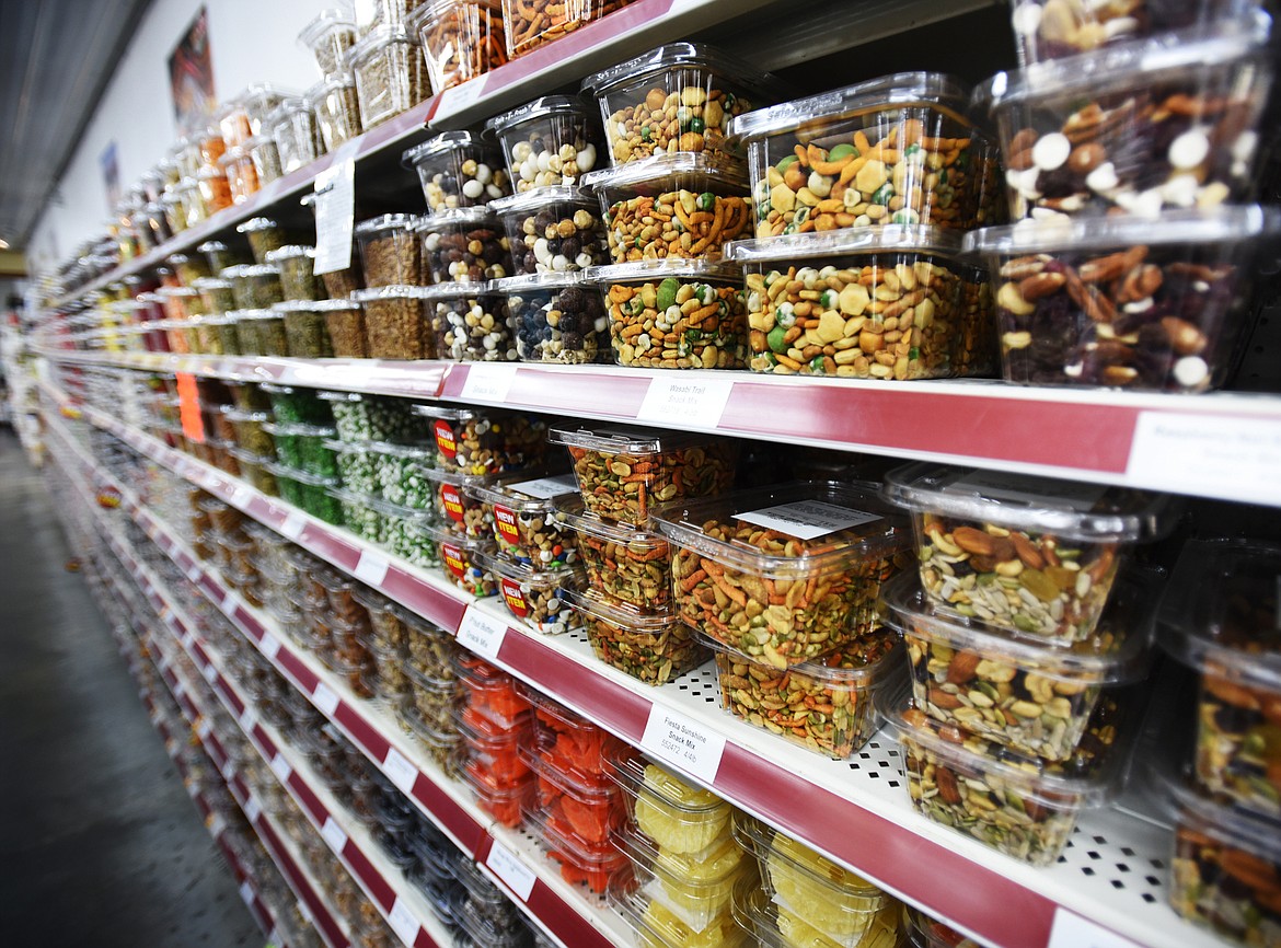 Rows of packaged bulk items at the Mission General Store in St. Ignatius. Items include rice mixes, dried soups, granola, chocolates, nuts and other treats.(Brenda Ahearn/Daily Inter Lake)