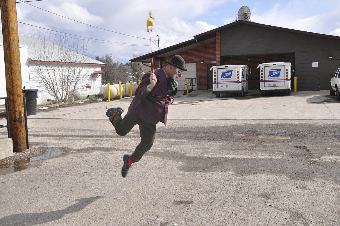 &#147;BOBO THE HOBO,&#148; portrayed by Travis Bynum, performs part of his act in an alley in Ronan. (Ashley Fox/Lake County Leader)