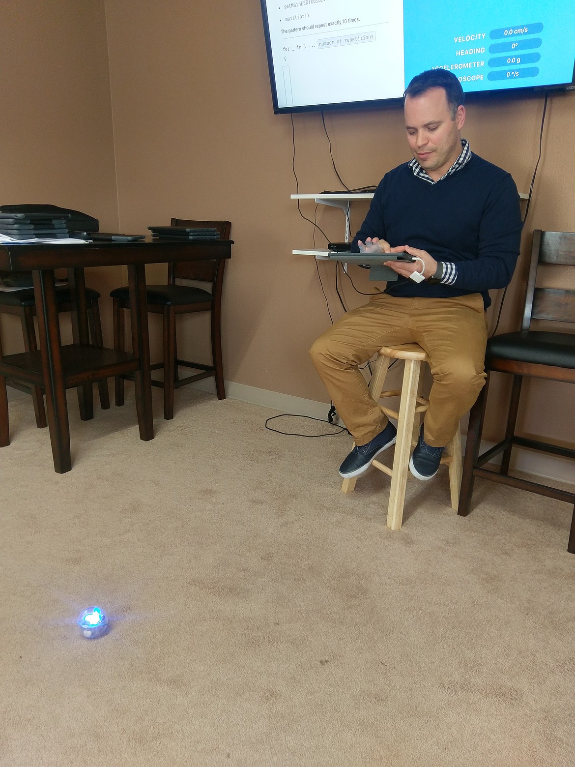 Photo by CHANSE WATSON
An Apple representative demonstrates how the “Sphero Robots” can be programed with the use of Swift. Attendees were able to change the color of the robots and direct them where to move by inputing Swift codes into iPads.