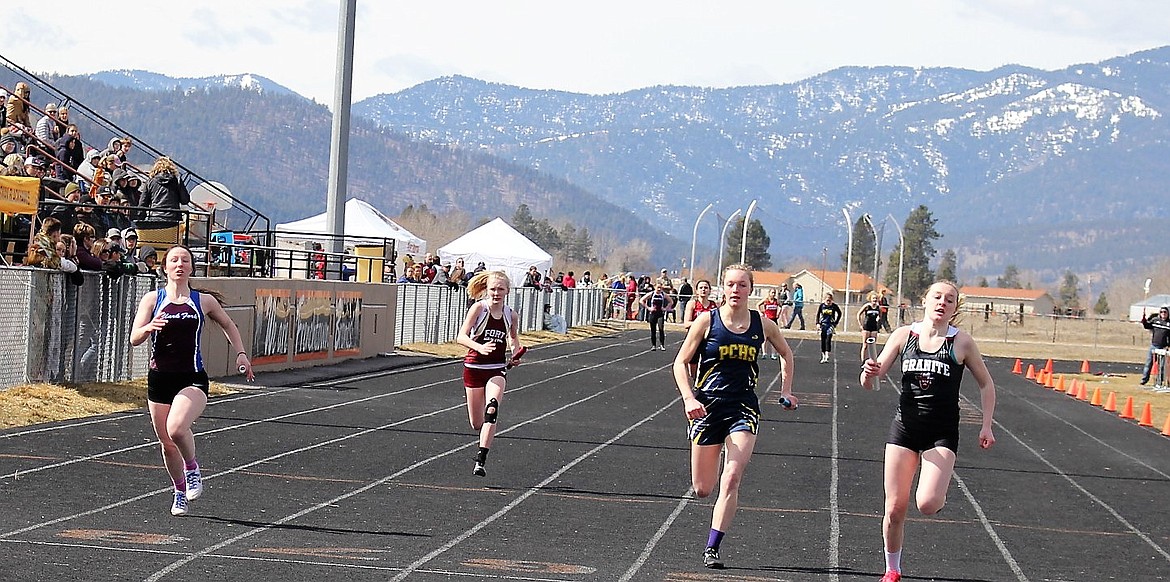 Madison Lommen, Clark Fork (far left) crosses the finish line in the girls relay. The team came in 5th in the 4x100 and 4th in the 4x400 during Thursday&#146;s track meet in Frenchtown. (Kathleen Woodford/Mineral Independent).