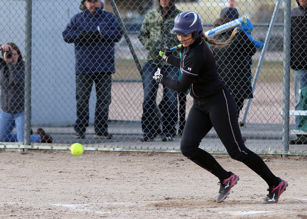 POLSON HIGH School softball player Quinn Motichka slaps a ball into the infield during the 8-5 victory over Libby High School Thursday afternoon at Polson High School. The Lady Pirates&#146; victory over conference-favorite Libby was a key critical victory in building the team&#146;s confidence, Pirates&#146; manager Larry Smith told the media. (Photo courtesy of Bob Gunderson)