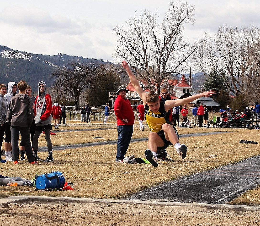 St. Regis&#146;s Ian Farris flies into a triple jump during the Jim Johnson Track Meet on March 29. (Kathleen Woodford/Mineral Independent)