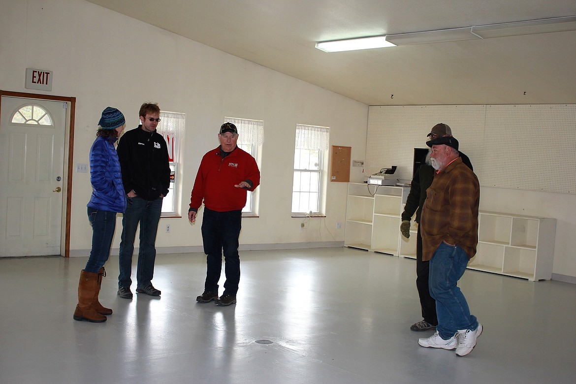 Janelle Ramaker (left), Aaron Hanson, George Bailey (red jacket), Glenn Koepke and Denley Loge toured the old antiques store in St. Regis as a potential location for the Northwest Energy Storage and Training Center. (Kathleen Woodford/Mineral Independent)