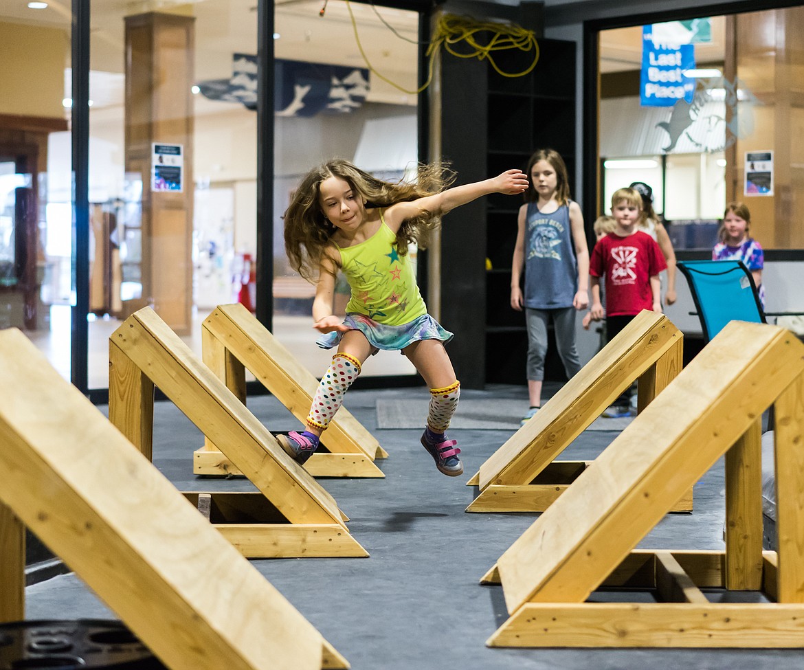 Laelia Pappenfus races through the quintuple steps on a recent Saturday as part of the Ninja Climbers camp at Rockfish Fitness and Climbing. (Daniel McKay photos/Whitefish Pilot)