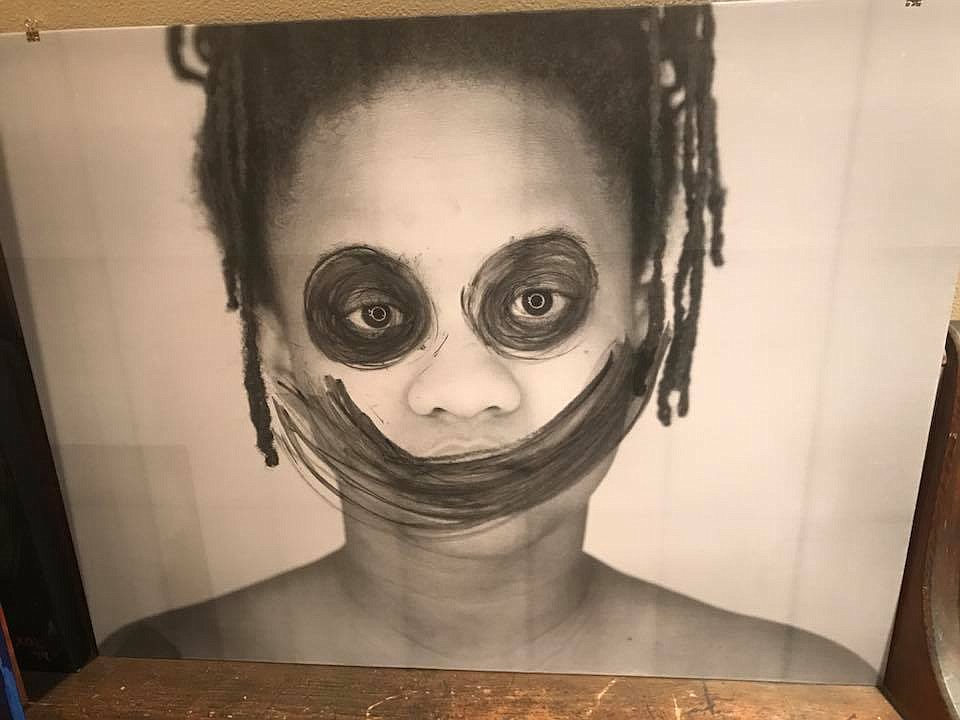 This piece by artist Myesha Callahan Freet - a smile drawn over a self-portrait - brings attention to society&#146;s tendency to expect women to always smile.