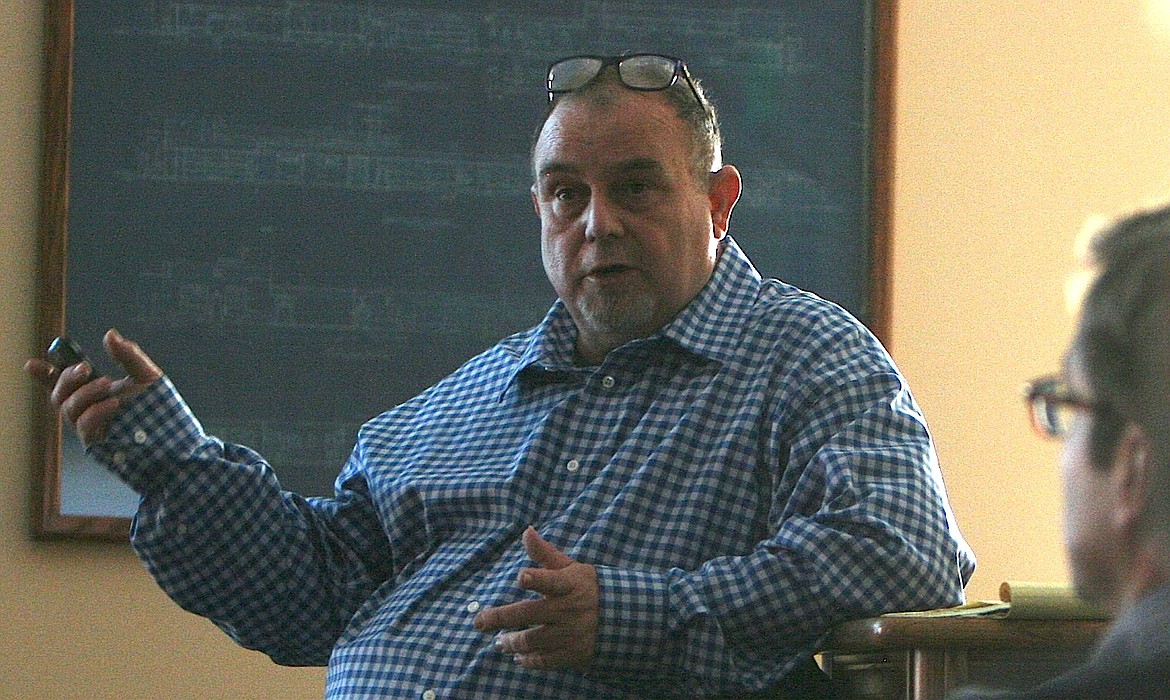 Bentley Erdwurm, utilities analyst for the Idaho Public Utilities Commission, answers questions about the proposed Avista Utilities-Hydro One Limited merger at the Midtown Meeting Center in Coeur d'Alene on Wednesday night. (BRIAN WALKER/Press)