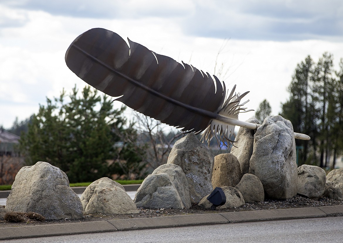 Northwest artists and friends David Govedare and Keith Powell, who created the public art display along Northwest Boulevard, will auction off two smaller model feathers this Friday during Birds of Prey Northwest's &quot;Fly Like An Eagle&#148;  program at The Coeur d'Alene Resort. (LOREN BENOIT/Press)